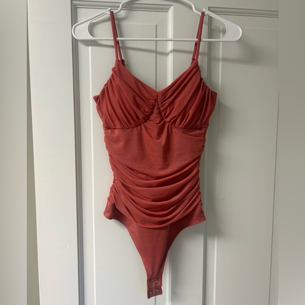 Brand new, never worn, Express body suit.